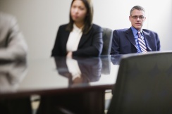 Businesspeople sitting at conference table